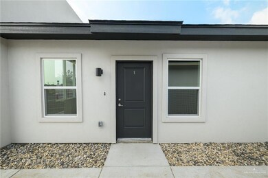 Doorway to property with stucco siding