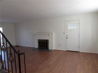 new laminate flooring in the living room, door to 