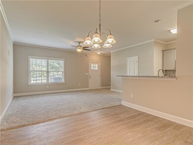 Unfurnished room featuring crown molding, light wo