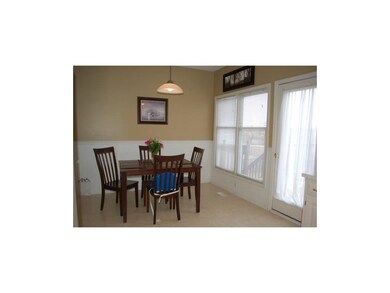 Dinning area has view and walks out to deck.