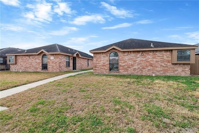 Ranch-style house featuring a front yard