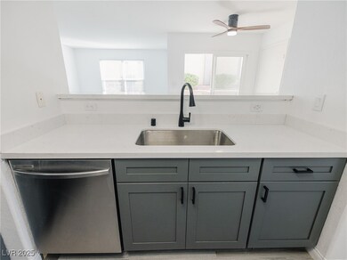 Kitchen featuring stainless steel dishwasher, gray