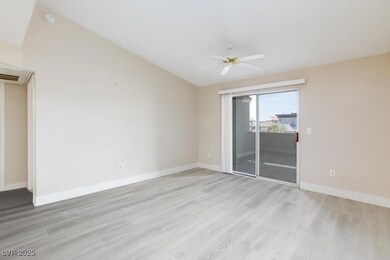 Spare room featuring light wood-style floors, a ce