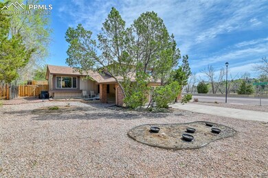 Ranch-style house with brick siding and fence