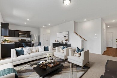 Carpeted living area featuring recessed lighting