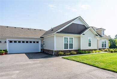 View of front facade featuring garage and a front