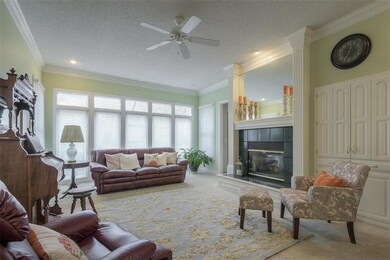 Living Room with a see-through fireplace to the ki
