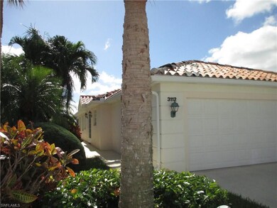 Attached 2 car garage, side entrance with lush lan