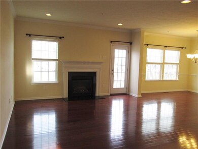 Open floor plan with gas log fire place in living 