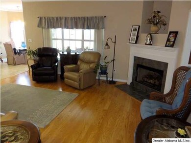 The living room fireplace is the perfect spot to c