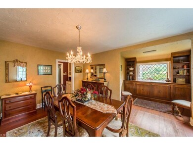 Spacious dining room with hardwood floor and built