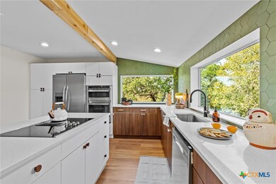 The kitchen is a masterpiece, with bespoke cabinet