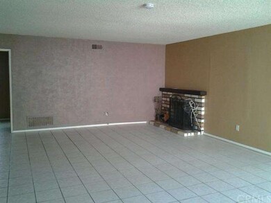 Tiled floors, fireplace, in large living room, adj