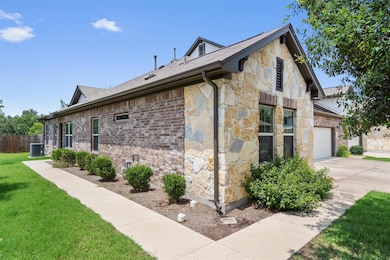 View of property exterior featuring stone siding,