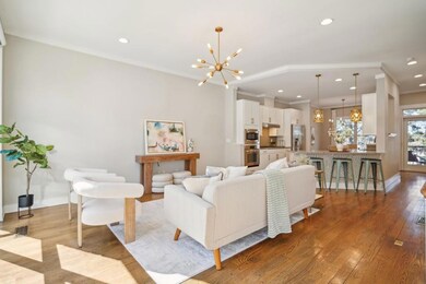 Kitchen is conveniently located between the living