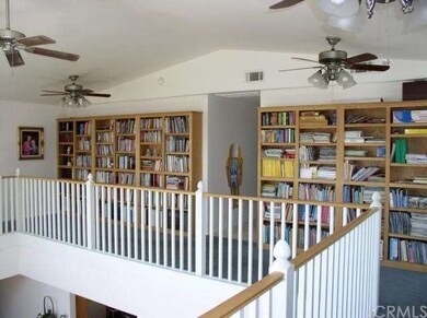 Upstairs balcony area with built in book shelves