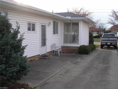 Side entrance, also has sliding glass doors to pat