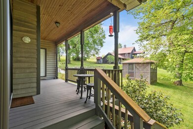 One of back entrances with the hot tub and barn in the background 