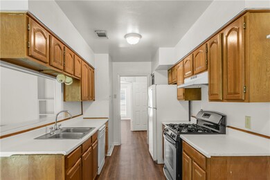 Kitchen with stainless steel gas range oven, under