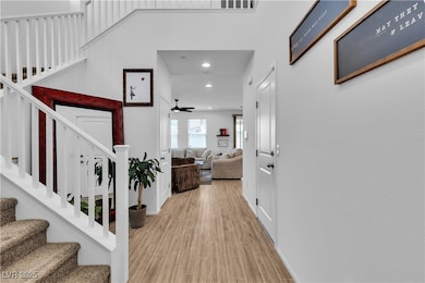 Entryway featuring recessed lighting, stairs, a ce