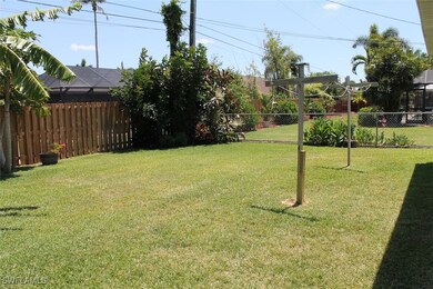 View of yard featuring glass enclosure