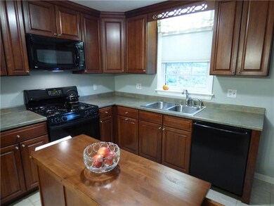 Kitchen with rich wood cabinets