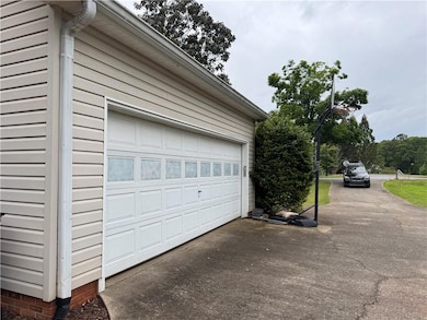 Garage featuring driveway