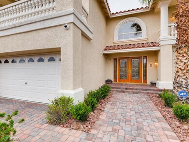 Paver driveway and walk invite guests to the grand