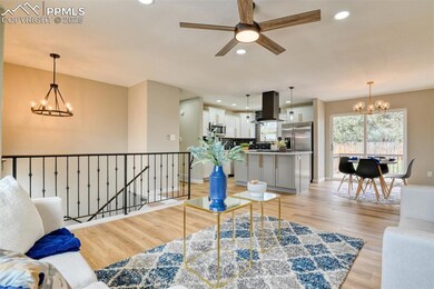 Living room featuring baseboards, light wood-type 