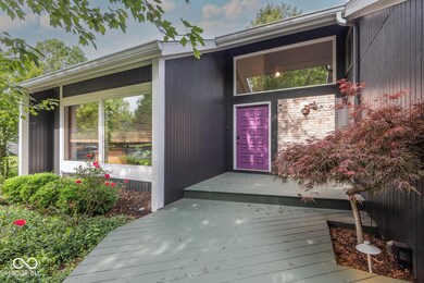 property entrance with a deck