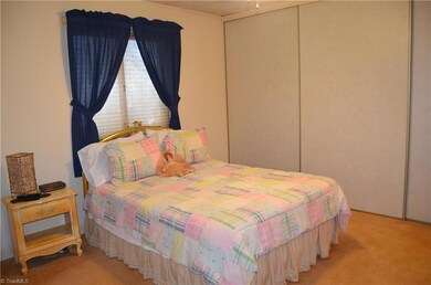 Closet with sliding doors spans entire wall...lots of storage!