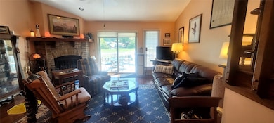 Living Room w/Vaulted Ceiling & Fireplace