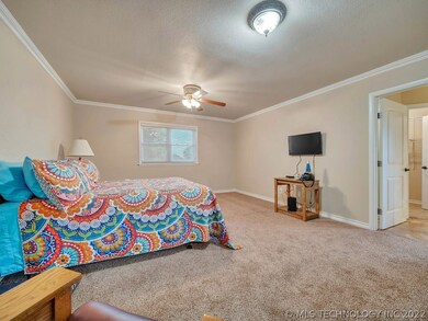 Large and bright master bedroom with new carpet, p