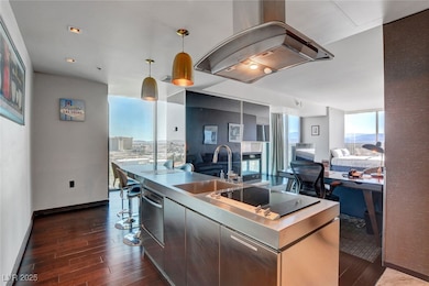 Kitchen featuring a sink, black electric stovetop,