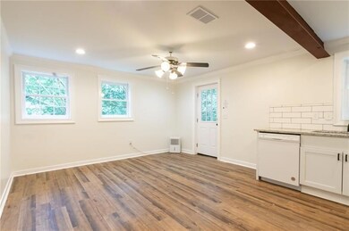 Unfurnished dining area with ornamental molding, light wood-style floors, plenty of natural light, a ceiling fan, and recessed lighting