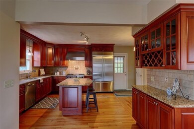 Chef's kitchen with custom cabinetry, granite coun