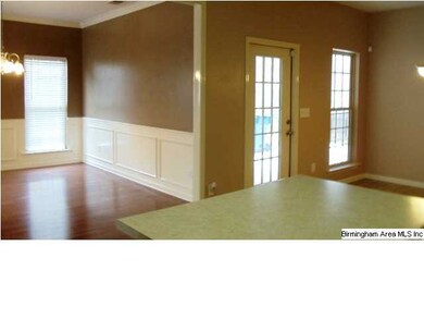 view from kitchen into dining room-- you will appr