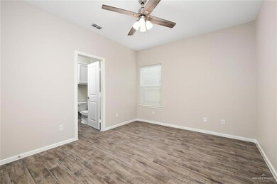 Unfurnished room featuring ceiling fan and wood finished floors