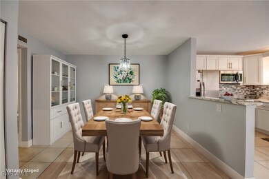 Dining area featuring light tile patterned floors