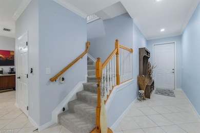 Stairs with tile patterned floors and ornamental m
