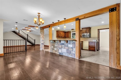 Unfurnished living room with beamed ceiling, ornat