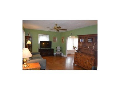 Spacious living room that opens to the formal dining room.