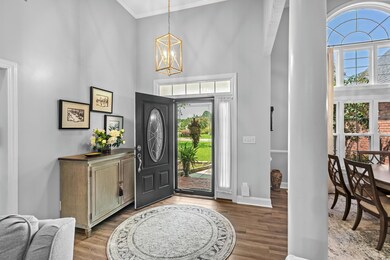 Foyer entrance with light hardwood / wood-style fl