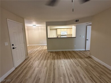 Unfurnished living room featuring baseboards, visi