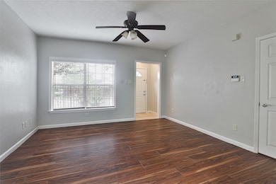 Living room with huge window for lots of natural light.