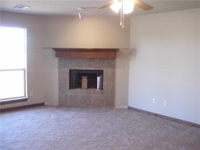 Bright and open living room with corner fire place