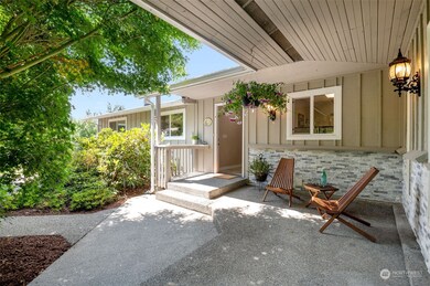 Covered entrane with gorgeous maples and dogwoods to shade you and give you your perfect country front porch
