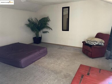 Bedroom featuring vaulted ceiling and carpet