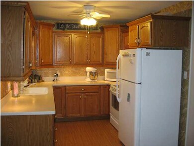 Updated cabinets and flooring in the kitchen. Appl