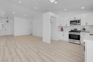 Kitchen featuring stainless steel appliances, loft